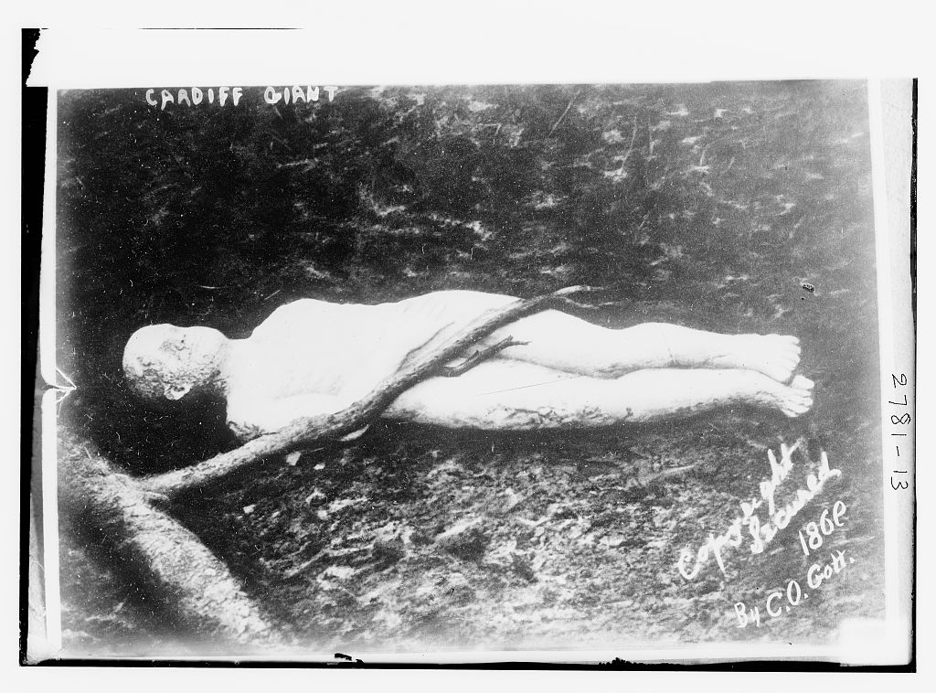 The Cardiff Giant photographed on display, its theatrical presentation helping a carved figure become a national spectacle.