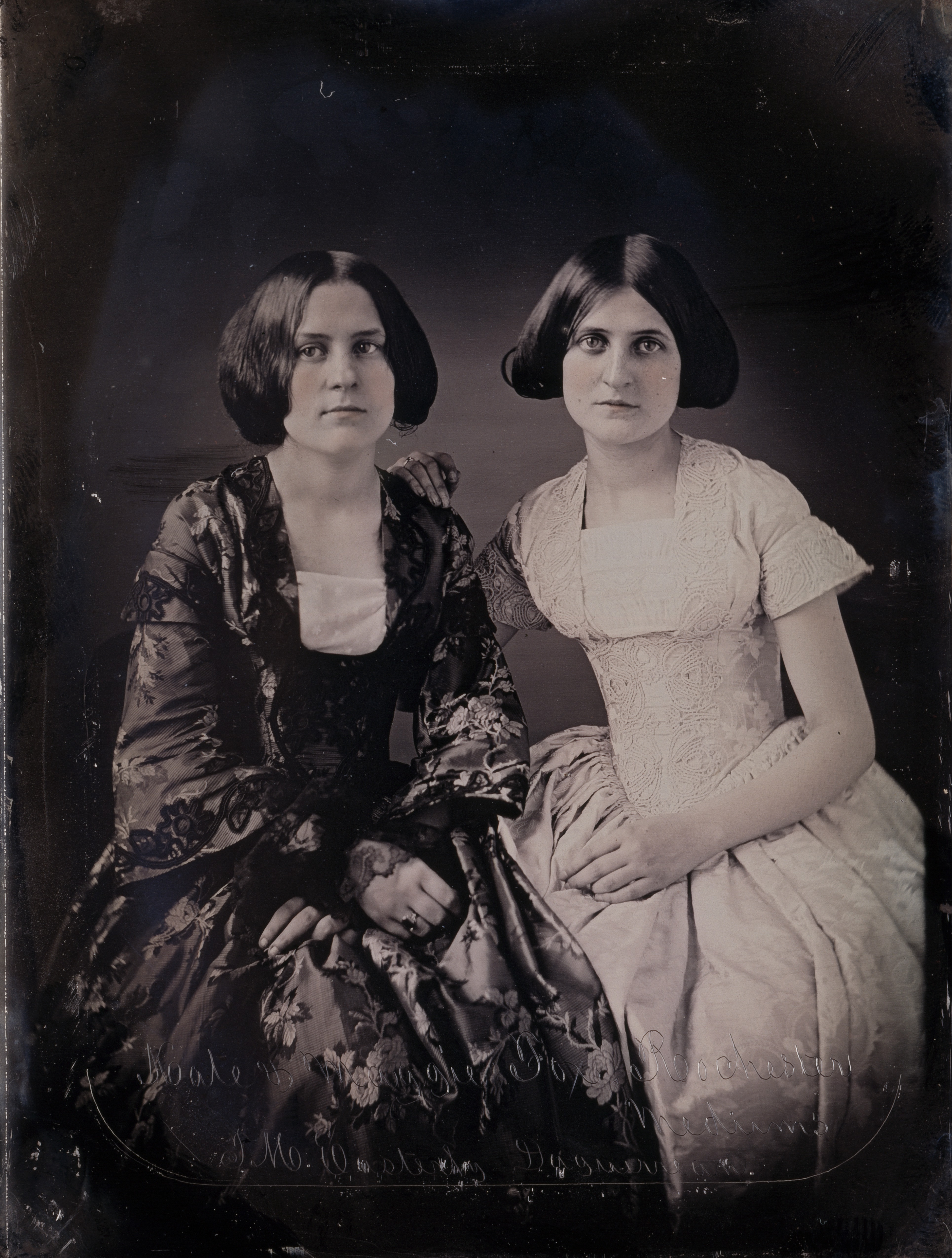 Kate and Maggie Fox in an 1852 daguerreotype, photographed after the Hydesville rappings had made them public figures.