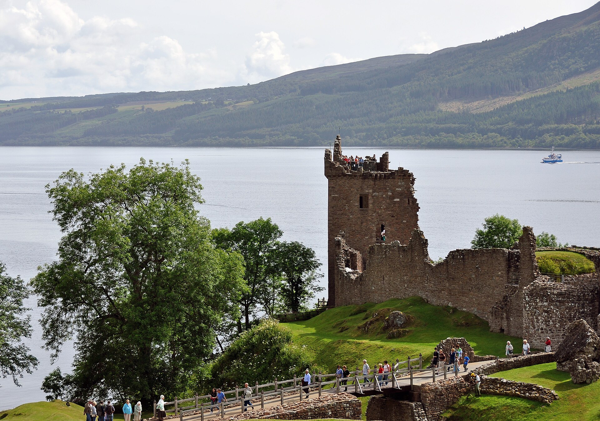 Loch Ness seen from Urquhart Castle. The broad water and limited scale cues help explain why distance and object size are central problems in interpreting sightings on the loch.