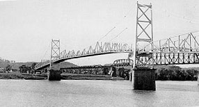 The Silver Bridge at Point Pleasant after its completion in 1928. The bridge was a real engineering structure with a documented failure history; its later connection to creature reports belongs to the legend-building layer.
